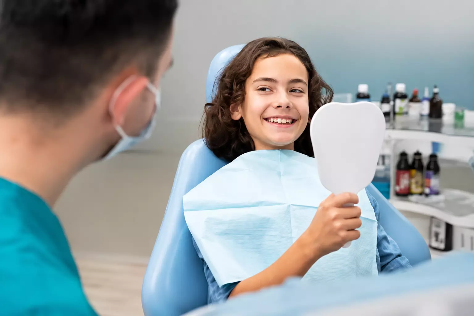 Child smiling with dentist